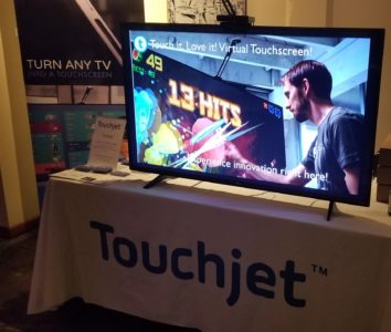 TouchJet WAVe demo video, showing Fruit Ninja being played with their product 