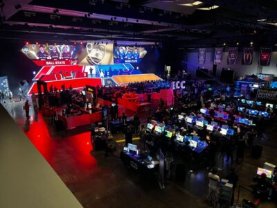 Arial view of the CECc Texas 2024 Arena with fans and on-stage competition.