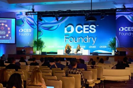 "CES Foundry" image behind two speakers discussing a topic at CES 2025.